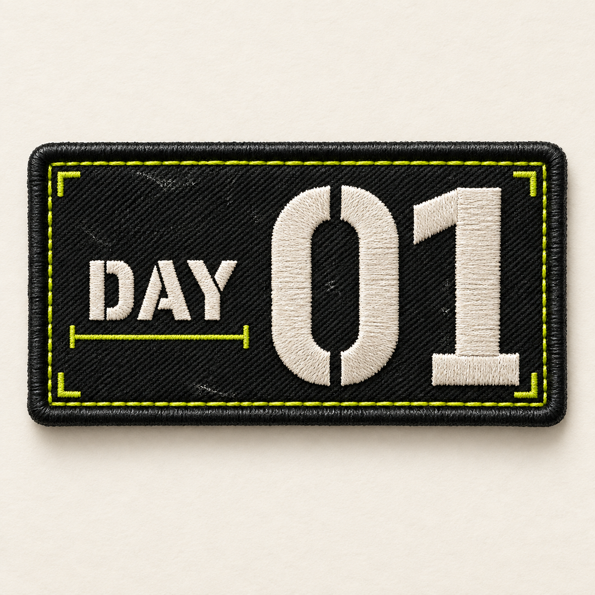 Day 01 embroidered LILMATEEN patch on cream background