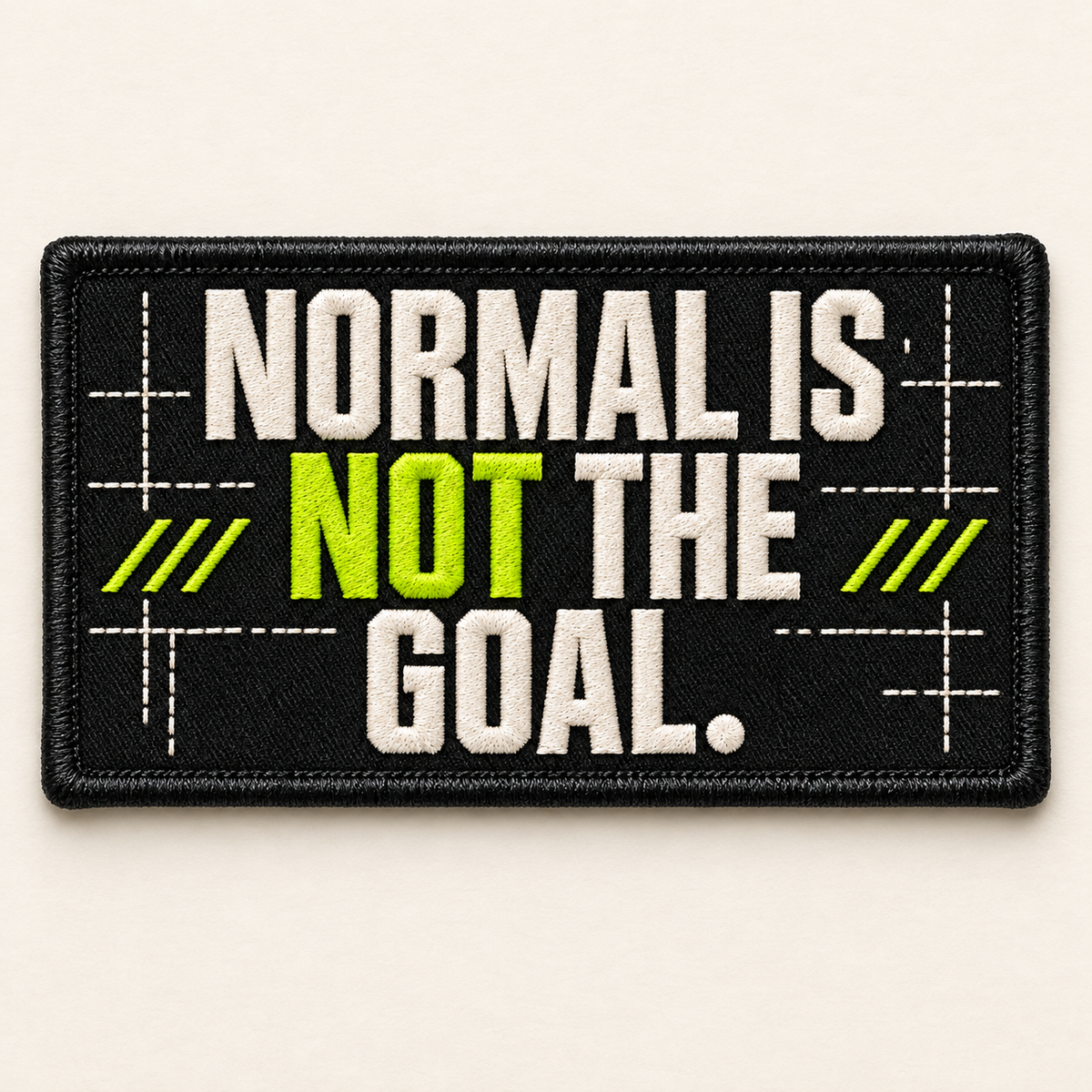 Normal Is Not the Goal embroidered LILMATEEN patch on cream background