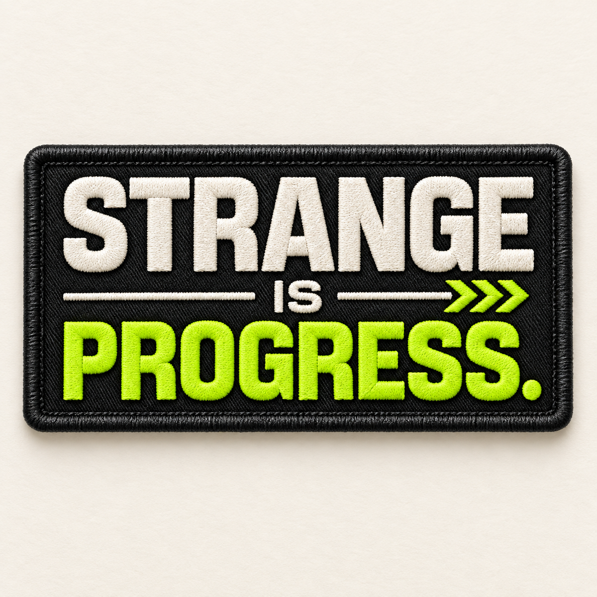 Strange Is Progress embroidered LILMATEEN patch on cream background