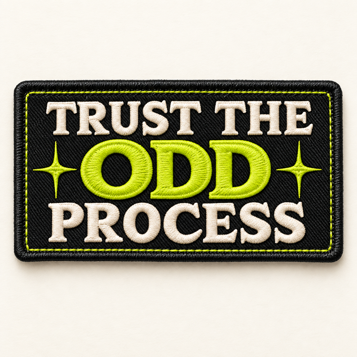 Trust the Odd Process embroidered LILMATEEN patch on cream background